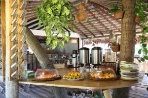 a table with fruit on it in a kitchen at Pousada BGK in Barra Grande