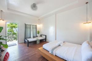 Postel nebo postele na pokoji v ubytování YAMA APARTMENTS - Private Beachfront