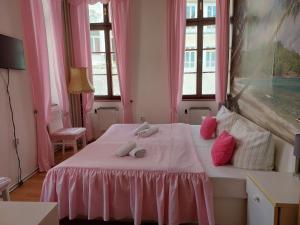 Postel nebo postele na pokoji v ubytování Hotel Asila