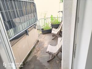 a pair of chairs sitting on a balcony at FMI33 Next to Airport in Kelsterbach