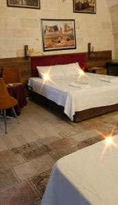 a bedroom with a large bed with lights on it at Şark Çırağan Konak Boutique Hotel in Urfa +59 photos