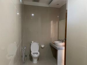 a small bathroom with a toilet and a sink at Kusuma Life in Kerobokan +22 photos