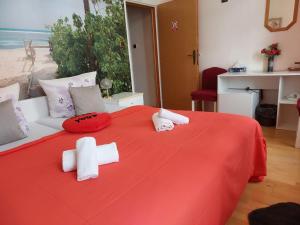 Postel nebo postele na pokoji v ubytování Hotel Asila