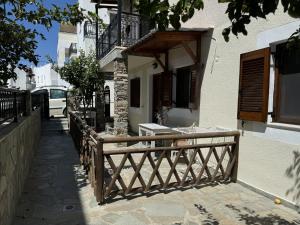 a wooden fence in front of a building at Naxian Harmony Town Suites in Naxos Chora