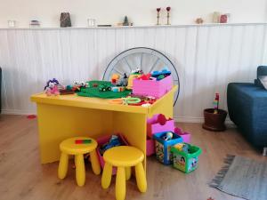 a toy table and two stools in a living room at Aagaarden in Billund