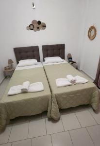 A bed or beds in a room at Dionysus House Lasithi Plateau