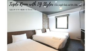 Cama o camas de una habitación en Henn na Hotel Tokyo Akasaka