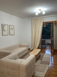 a living room with a couch and a table at Urlaub mit Kinder und Freunden in Santa Ponsa