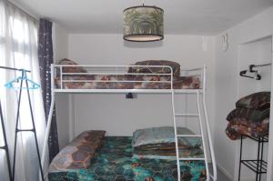 a bedroom with two bunk beds in a room at Dawlish Warren Welcome Family Holiday Park Villa Clover Welcome2Warren South Devon in Dawlish Warren +33 photos
