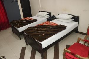 Ένα ή περισσότερα κρεβάτια σε δωμάτιο στο Hotel Grace Inn Multan