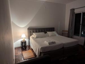 Postel nebo postele na pokoji v ubytování Casa Estrela - Sea & Art Guesthouse