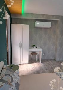 a room with a white desk and a bed at Къща за гости Мурите in Sapareva Banya
