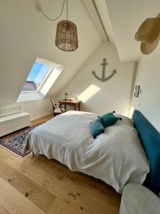 a bedroom with a bed and a large window at Markt 15 in Weiden am See +114 photos