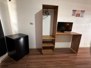 a room with a desk with a computer and a monitor at Hotel La Villa Morena in Oiapoque