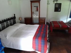 Postel nebo postele na pokoji v ubytování Posada El Molino de San Luis
