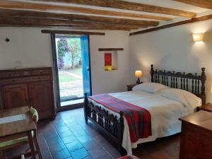 Postel nebo postele na pokoji v ubytování Posada El Molino de San Luis