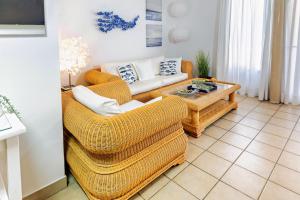 a living room with two couches and a coffee table at Esquinzo Playa 3 Jandia Fuerteventura in Playa Jandia