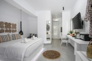 Ένα ή περισσότερα κρεβάτια σε δωμάτιο στο Calma Luxury Studios & Suites