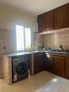 a kitchen with a washing machine in the kitchen at 3 Chaaban 1, 1136 in Larache