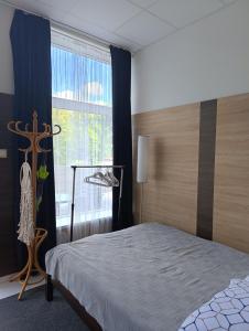 Ένα ή περισσότερα κρεβάτια σε δωμάτιο στο TRZY FALE Mielno Chrobrego 8 +40 φωτογραφίες