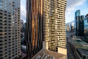 a view of a city skyline with tall buildings at Mega Style Apartments Light House in Melbourne