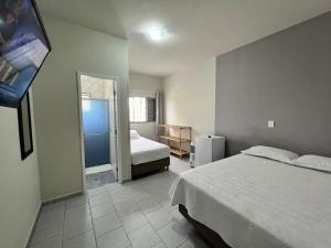Postel nebo postele na pokoji v ubytování Pousada Recanto turmalina