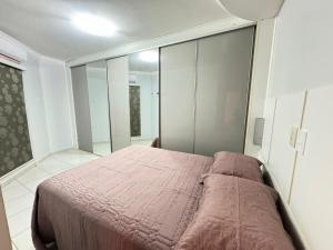 Ένα ή περισσότερα κρεβάτια σε δωμάτιο στο Privé das Thermas II - Via Caldas