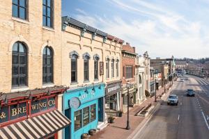 an empty street in an old town with buildings at Hip Urban Loft - Small Town Charm - 124 LOFTS #4 in West Dundee