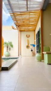 a hallway of a house with a room with a patio at Bohemian Private pool Villa - Fulton Casablanca in Beran-kidul