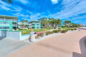 a trash can in a park next to a building at Tropic Terrace Suite #44 - Beachfront Resort in St Pete Beach