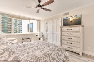 a bedroom with a bed and a ceiling fan at Sand Key South Beach Condo 601 in Clearwater Beach +41 photos