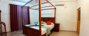 Voodi või voodid majutusasutuse Sasagara Beach Villa toas