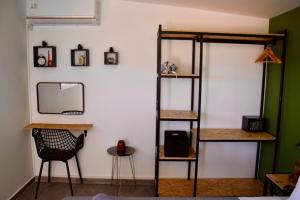 a room with a mirror and a shelf at Agros simple living in Frangokastello