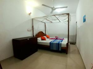 Voodi või voodid majutusasutuse Sasagara Beach Villa toas