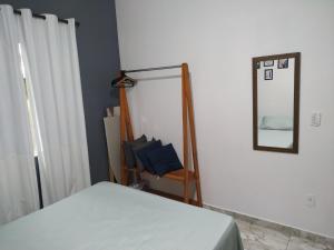 Ένα ή περισσότερα κρεβάτια σε δωμάτιο στο Flat Solife 2 Cabo Frio-Búzios