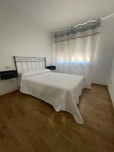 Ένα ή περισσότερα κρεβάτια σε δωμάτιο στο L'apartament de Carol