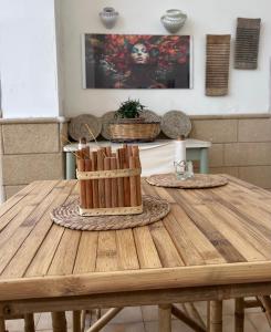 a wooden table in a room with at Il Giardino Segreto in Maglie