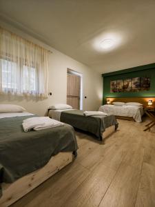 Postel nebo postele na pokoji v ubytování Borgo dei cervi B&B