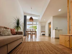 a living room with a couch and a table at UpTown Apartments in Horta
