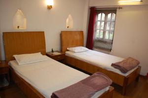 Postel nebo postele na pokoji v ubytování Central Bhaktapur Durbar Square-Sangi Homestay