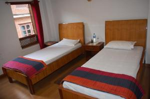 Postel nebo postele na pokoji v ubytování Central Bhaktapur Durbar Square-Sangi Homestay