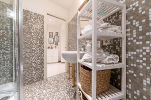 a bathroom with a sink and a mirror at Dolce Vita Suite in Trastevere in Rome +42 photos