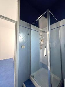 a shower with glass doors in a bathroom at Kalè in Giovinazzo +26 photos