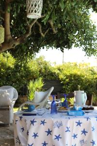 a blue and white table with blue stars on it at Kalè in Giovinazzo