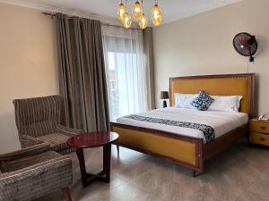 Postel nebo postele na pokoji v ubytování Starview Hotel Kampala