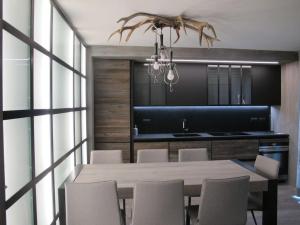a dining room with a table and chairs at CASA LUMIRA Luxury apartment ski-in ski-out in Breuil-Cervinia