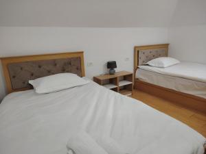 Voodi või voodid majutusasutuse Hotel Parc Geoagiu Bai toas