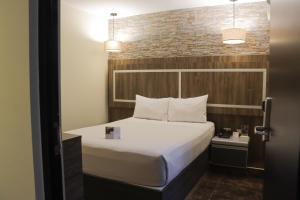 Postel nebo postele na pokoji v ubytování Rado Hotel - Santa María