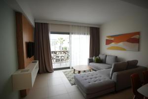 a living room with a couch and a table at Zephyr Agadir in Agadir