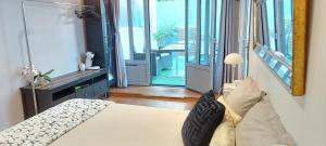 a bedroom with a bed and a view of a balcony at Villa Angelus in Nice
